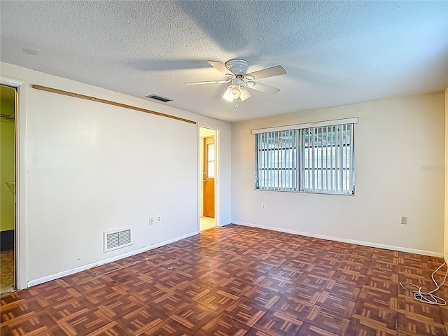 6250 7th Ave, New Port Richey, FL 34653 - spare room featuring ceiling fan and a textured ceiling