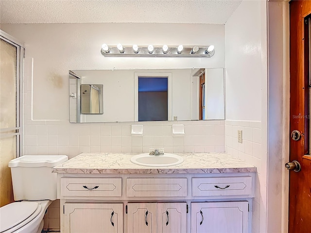 6250 7th Ave, New Port Richey, FL 34653 - full bathroom featuring tile walls, vanity, decorative backsplash, and a textured ceiling