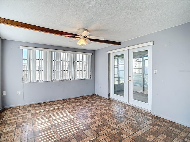 6250 7th Ave, New Port Richey, FL 34653 - unfurnished room with brick patterned flooring, french doors, a ceiling fan, a textured ceiling, and beamed ceiling