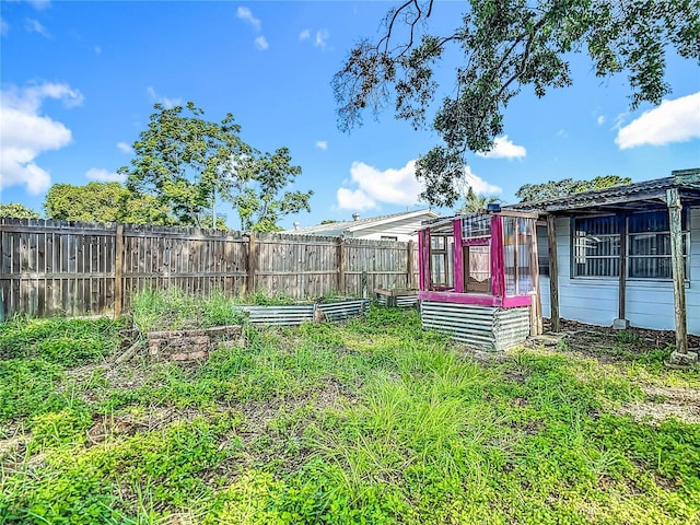 6250 7th Ave, New Port Richey, FL 34653 - fenced backyard featuring a garden
