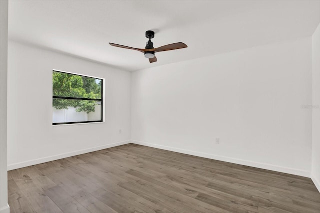10319 Alberta Ct, New Port Richey, FL 34654 - unfurnished room featuring wood finished floors and a ceiling fan