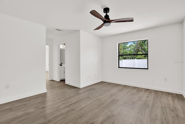10319 Alberta Ct, New Port Richey, FL 34654 - unfurnished room with wood finished floors and ceiling fan