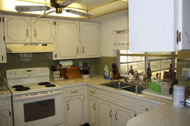 7534 Betula Dr, New Port Richey, FL 34653 - kitchen featuring white electric range, under cabinet range hood, ceiling fan, backsplash, and light countertops