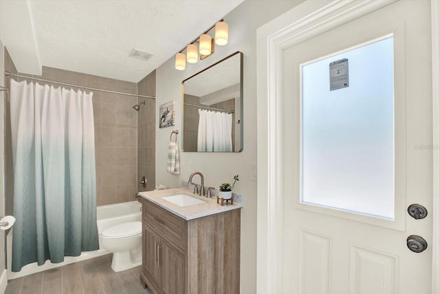 11890 Walker Ave, Seminole, FL 33772 - full bath featuring vanity, shower / tub combo with curtain, and wood finished floors