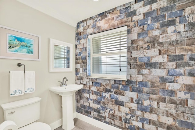 11890 Walker Ave, Seminole, FL 33772 - half bathroom with toilet and wood finished floors