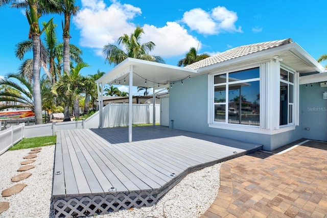 11890 Walker Ave, Seminole, FL 33772 - wooden deck with a fenced backyard