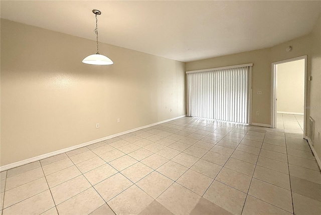 6448 Cypressdale Dr Unit 101, Riverview, FL 33578 - spare room featuring light tile patterned floors and baseboards