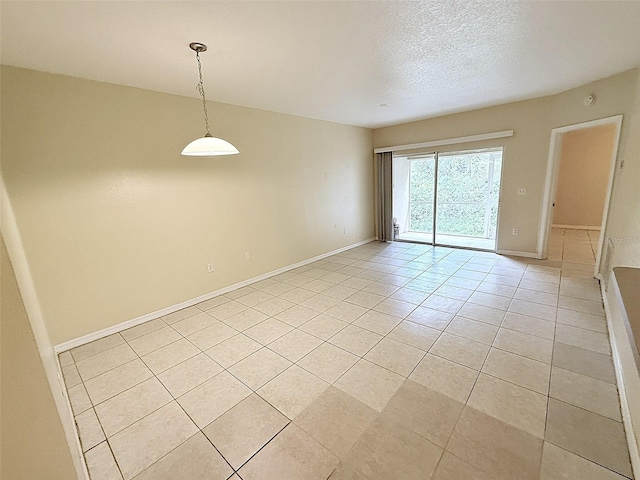 6448 Cypressdale Dr Unit 101, Riverview, FL 33578 - spare room featuring light tile patterned flooring and a textured ceiling
