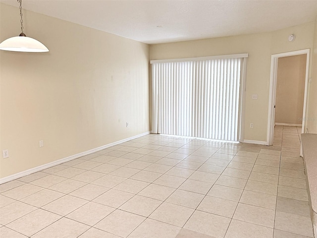 6448 Cypressdale Dr Unit 101, Riverview, FL 33578 - spare room featuring light tile patterned floors and baseboards