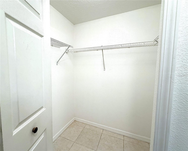 6448 Cypressdale Dr Unit 101, Riverview, FL 33578 - walk in closet with light tile patterned flooring