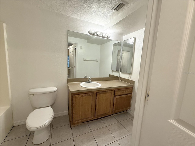 6448 Cypressdale Dr Unit 101, Riverview, FL 33578 - bathroom featuring tile patterned floors, vanity, and a textured ceiling