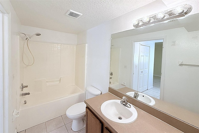 6448 Cypressdale Dr Unit 101, Riverview, FL 33578 - full bath featuring vanity, tile patterned flooring, shower / bath combination, and a textured ceiling