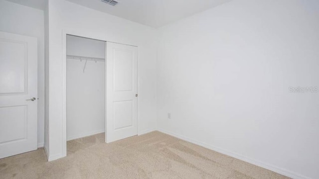 2091 Babbling Brook Blvd, Auburndale, FL 33823 - unfurnished bedroom with light carpet and a closet
