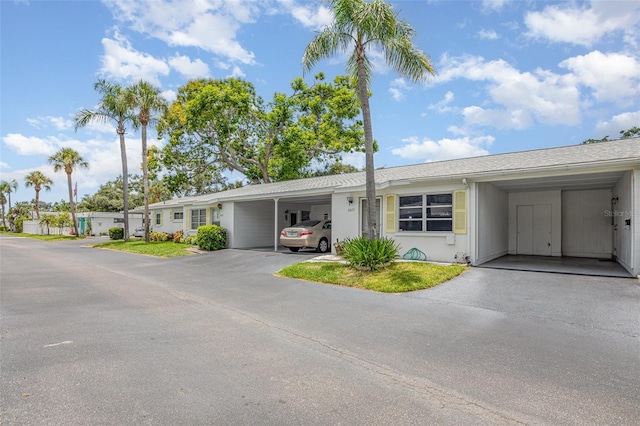 6015 Arlene Way, Bradenton, FL 34207 - single story home with a carport, a shingled roof, and driveway