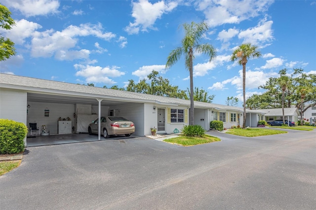 6015 Arlene Way, Bradenton, FL 34207 - single story home with a carport, driveway, and roof with shingles