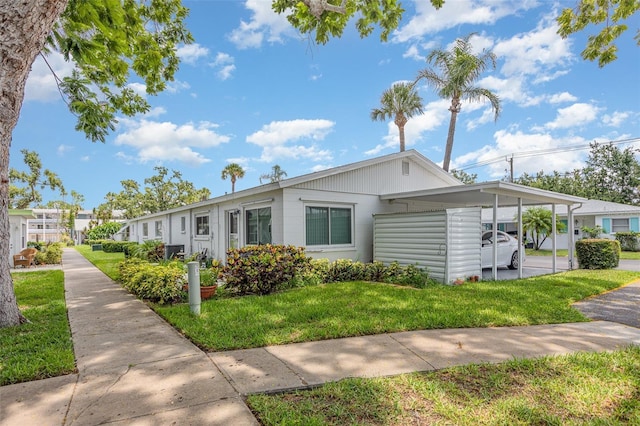 6015 Arlene Way, Bradenton, FL 34207 - view of front of home with a front yard and an attached carport