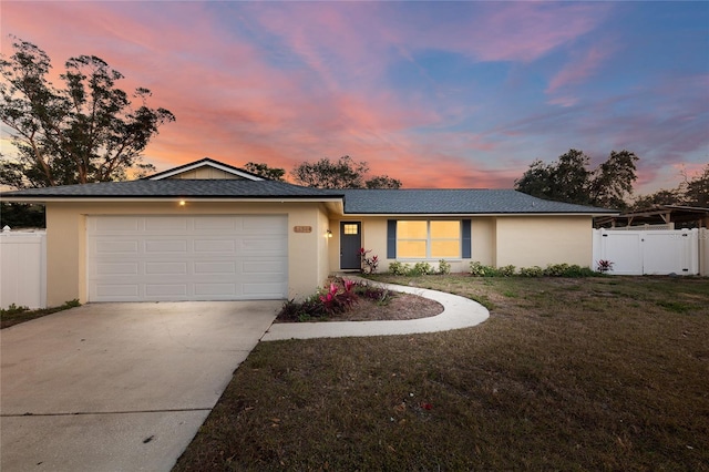 13344 Sorrento Dr, Largo, FL 33774 - ranch-style home featuring concrete driveway, stucco siding, and an attached garage