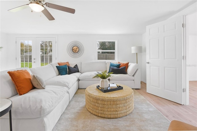 13344 Sorrento Dr, Largo, FL 33774 - living area with french doors, light wood finished floors, and ceiling fan