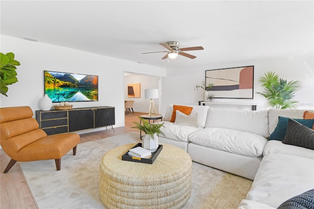 13344 Sorrento Dr, Largo, FL 33774 - living area with wood finished floors and ceiling fan