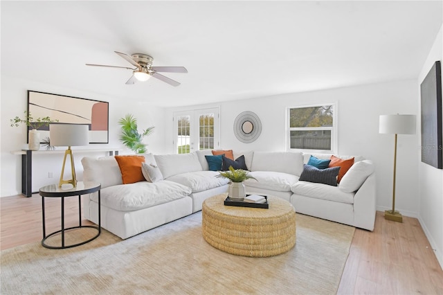 13344 Sorrento Dr, Largo, FL 33774 - living area featuring healthy amount of natural light, wood finished floors, and a ceiling fan