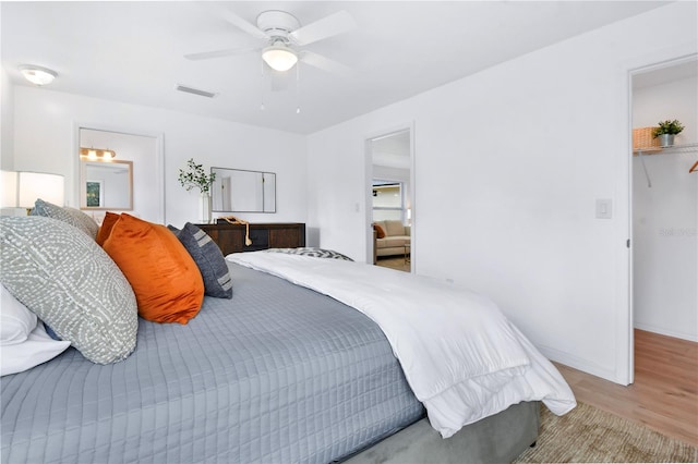 13344 Sorrento Dr, Largo, FL 33774 - bedroom with wood finished floors and ceiling fan