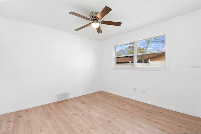 13344 Sorrento Dr, Largo, FL 33774 - unfurnished room with light wood finished floors and a ceiling fan