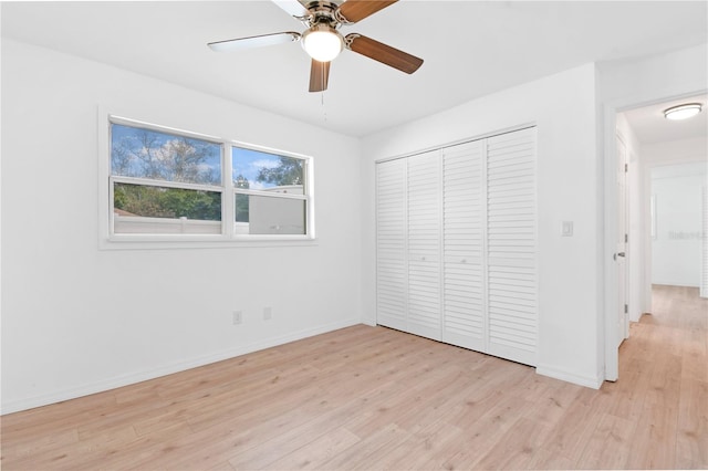 13344 Sorrento Dr, Largo, FL 33774 - unfurnished bedroom with light wood-type flooring, a closet, and a ceiling fan