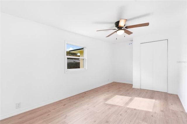 13344 Sorrento Dr, Largo, FL 33774 - empty room with light wood finished floors and a ceiling fan
