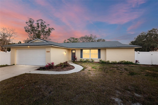 13344 Sorrento Dr, Largo, FL 33774 - single story home featuring stucco siding, concrete driveway, an attached garage, and a gate