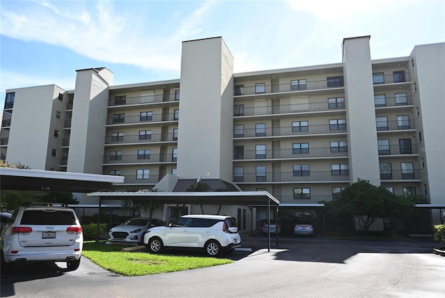 2800 Cove Cay Dr Unit 5D, Clearwater, FL 33760 - view of apartment building / complex featuring covered parking