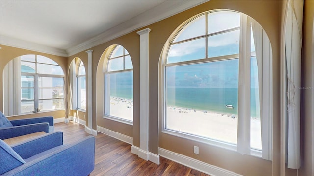 4950 Gulf Blvd Unit 1006, St Pete Beach, FL 33706 - sitting room with wood finished floors and crown molding