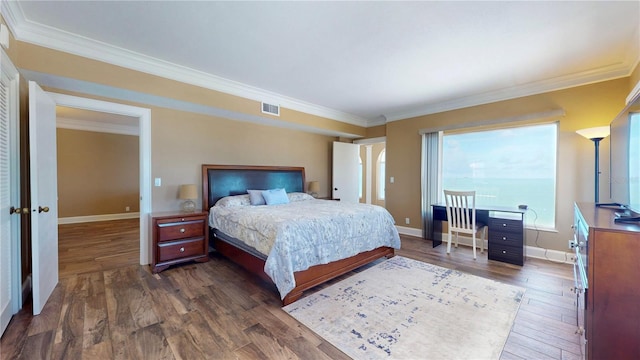 4950 Gulf Blvd Unit 1006, St Pete Beach, FL 33706 - bedroom featuring dark wood-style flooring and crown molding