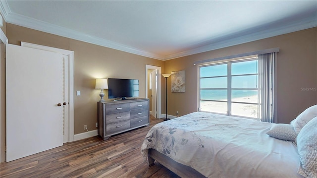 4950 Gulf Blvd Unit 1006, St Pete Beach, FL 33706 - bedroom with ornamental molding and dark wood-style flooring