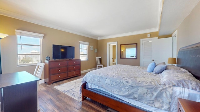 4950 Gulf Blvd Unit 1006, St Pete Beach, FL 33706 - bedroom featuring wood finished floors and ornamental molding