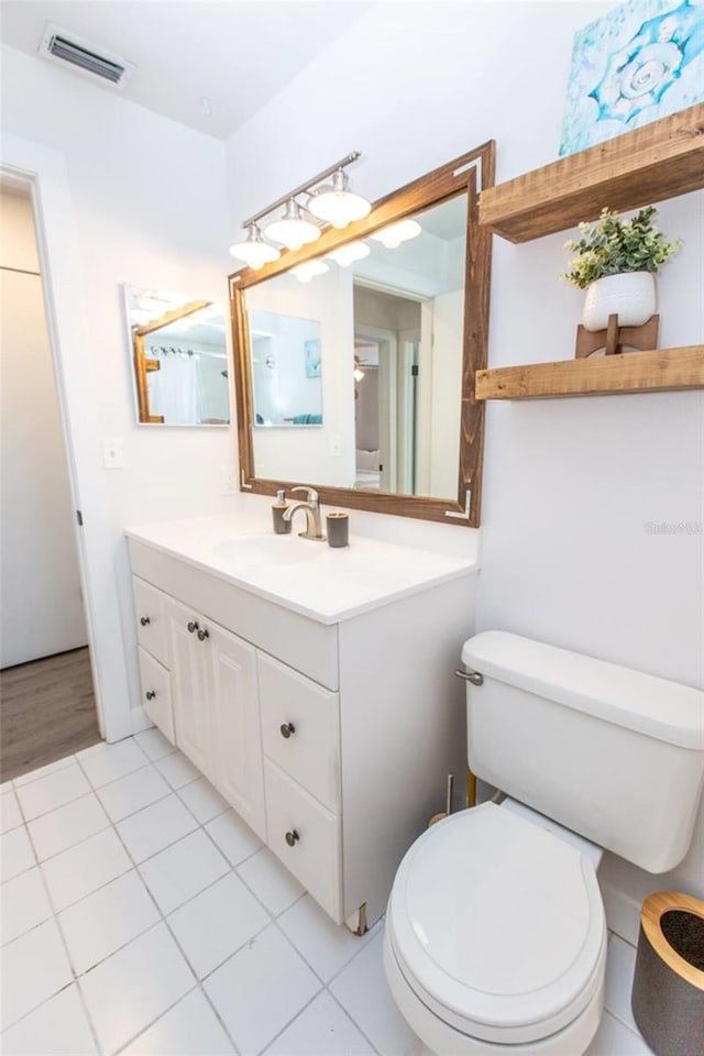 574 6th Ave SE, Largo, FL 33771 - bathroom featuring vanity and tile patterned flooring