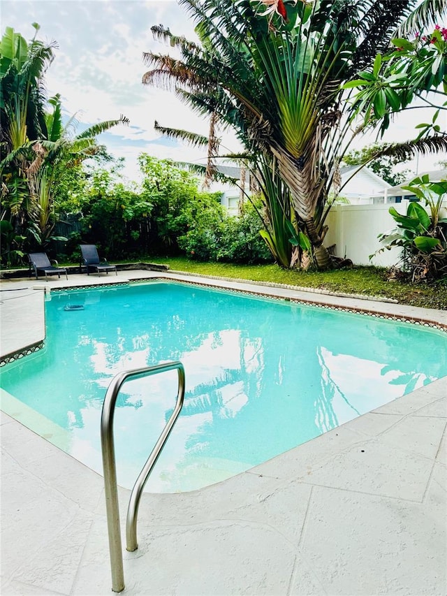 574 6th Ave SE, Largo, FL 33771 - view of swimming pool with a fenced backyard