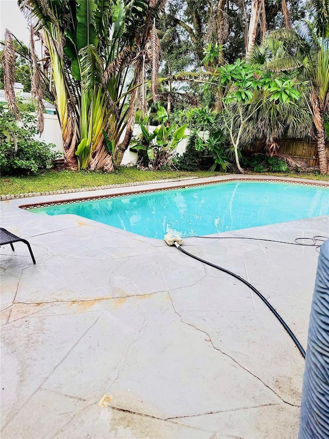 574 6th Ave SE, Largo, FL 33771 - view of swimming pool with a patio area