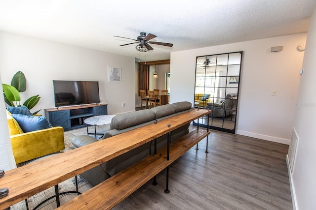 574 6th Ave SE, Largo, FL 33771 - living room with a ceiling fan and wood finished floors