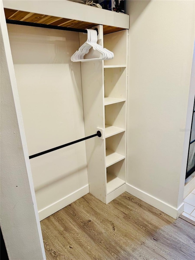 574 6th Ave SE, Largo, FL 33771 - spacious closet with wood finished floors
