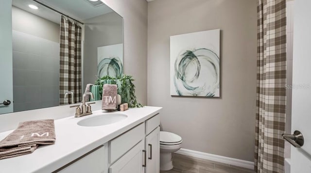 2128 Babbling Brook Blvd, Auburndale, FL 33823 - full bath with vanity, wood finished floors, and recessed lighting