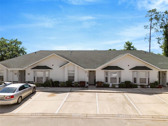 1150 Jade E Ln, Kissimmee, FL 34744 - view of building exterior with uncovered parking
