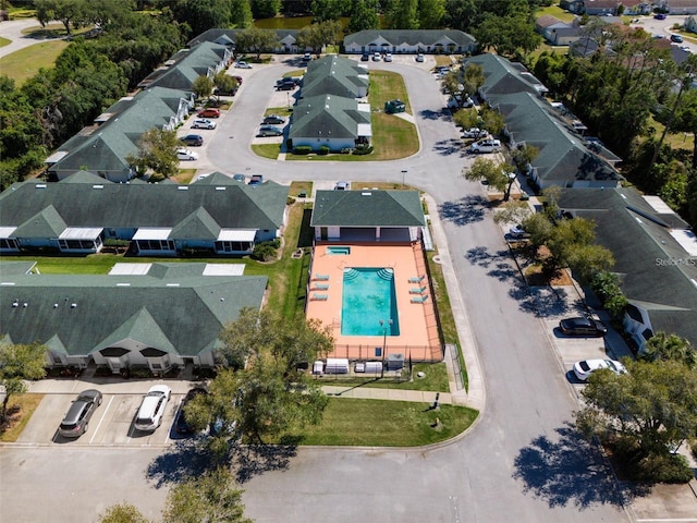 1150 Jade E Ln, Kissimmee, FL 34744 - aerial perspective of suburban area with a pool area
