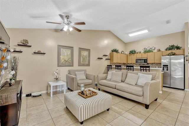 1150 Jade E Ln, Kissimmee, FL 34744 - living area with vaulted ceiling, light tile patterned floors, and a ceiling fan