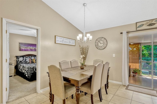 1150 Jade E Ln, Kissimmee, FL 34744 - dining room with light tile patterned floors, a chandelier, and lofted ceiling
