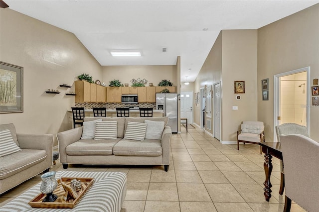1150 Jade E Ln, Kissimmee, FL 34744 - living area with light tile patterned flooring and high vaulted ceiling