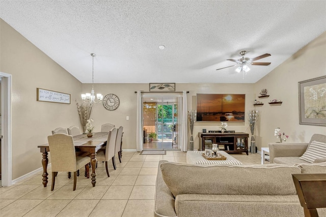 1150 Jade E Ln, Kissimmee, FL 34744 - living area featuring lofted ceiling, ceiling fan, a textured ceiling, light tile patterned flooring, and a chandelier