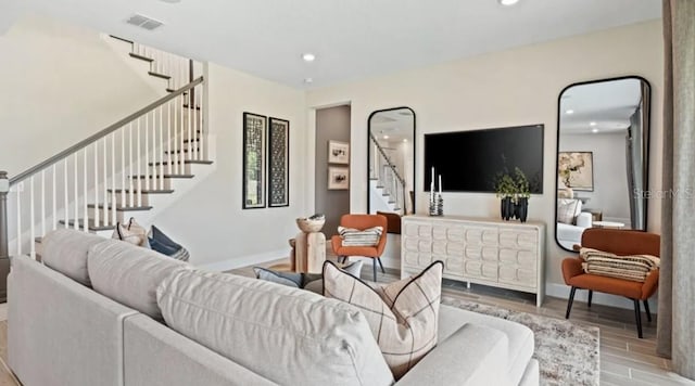 2422 Babbling Brook Blvd, Auburndale, FL 33823 - living room with stairs, wood tiled floors, and recessed lighting
