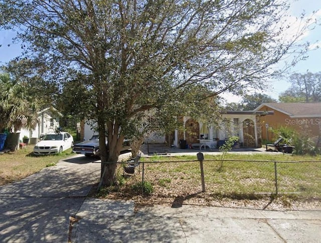 13097 120th St, Largo, FL 33778 - view of property hidden behind natural elements featuring concrete driveway