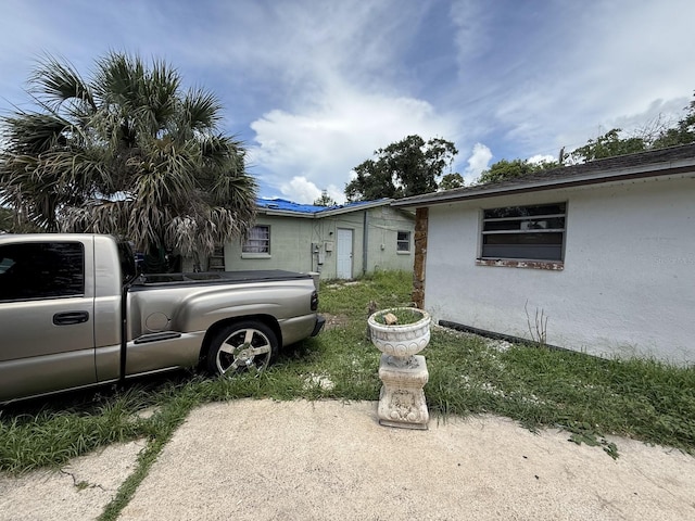 13097 120th St, Largo, FL 33778 - view of property exterior featuring stucco siding