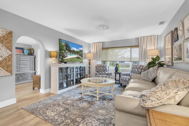 2009 Woodward Ave, Dunedin, FL 34698 - living area with arched walkways and wood finished floors